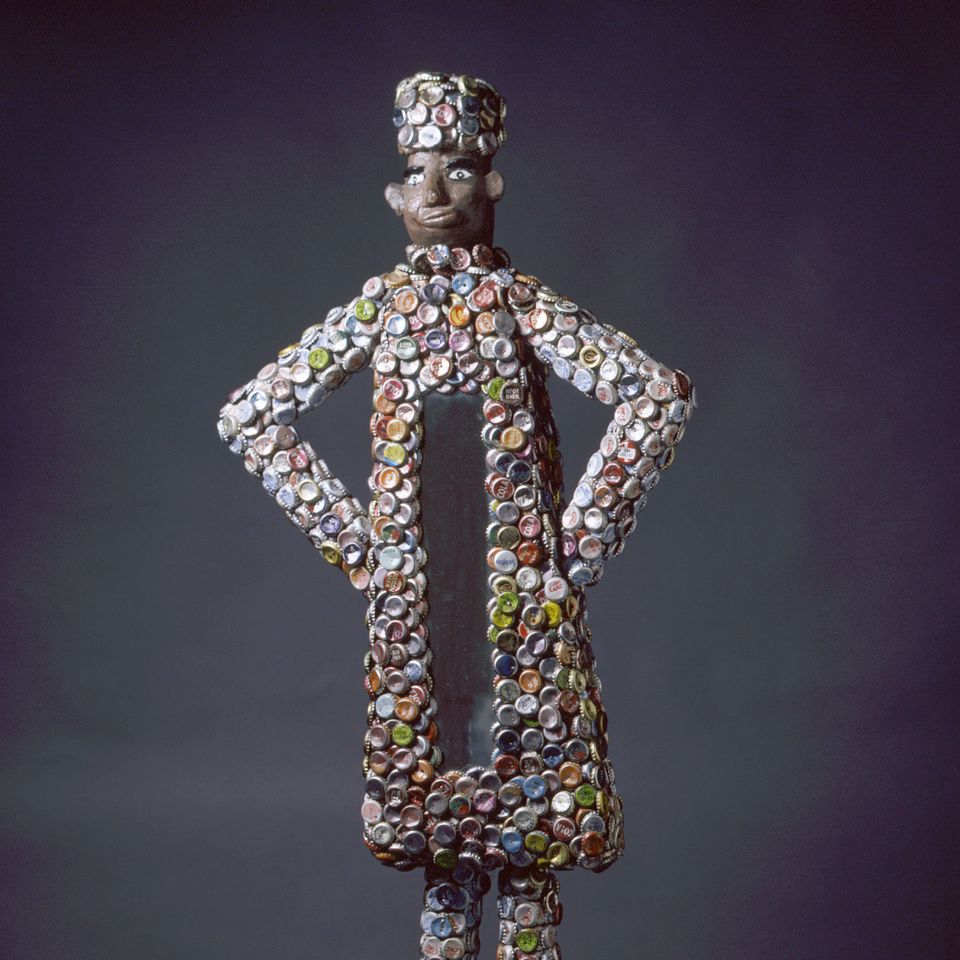 A photograph of an artwork made from bottle caps