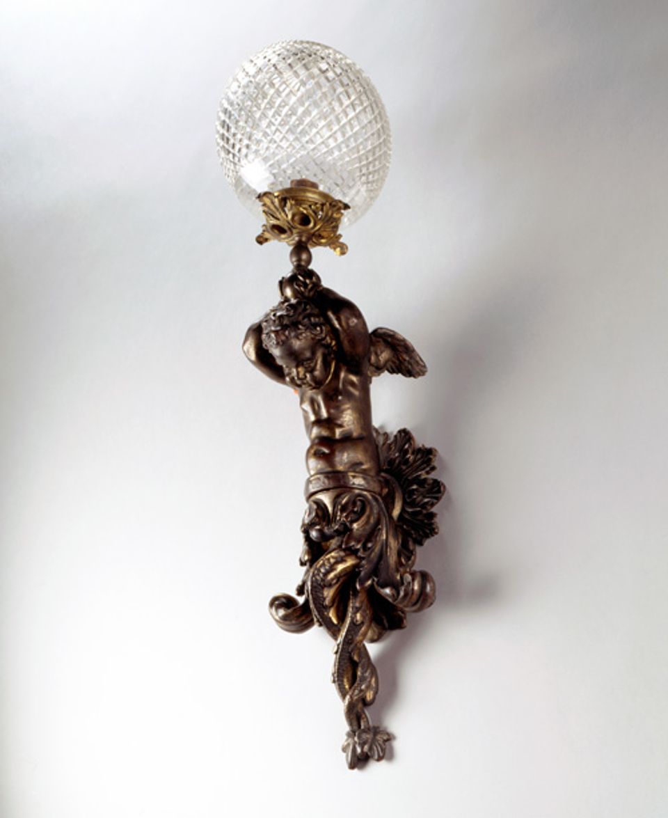 An image of a brass and cut glass sconce. 