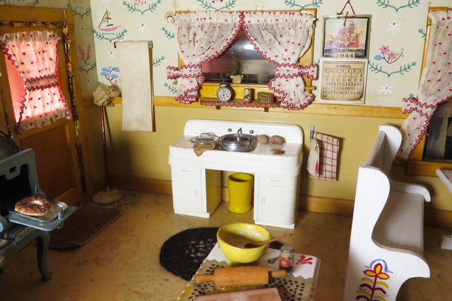 A photograph of a nutshell study of unexplained death showing a detail of a kitchen.