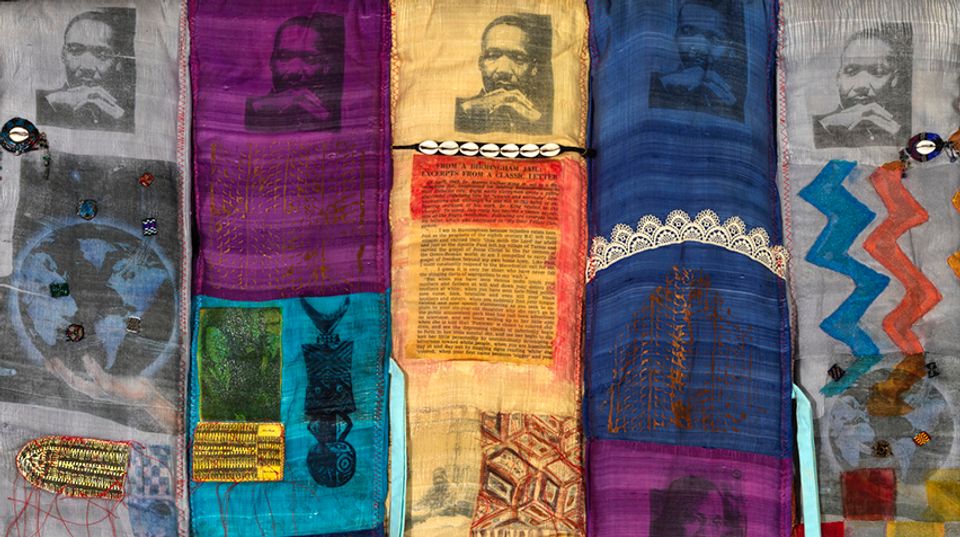 Detail of a quilt featuring images of Martin Luther King Jr.