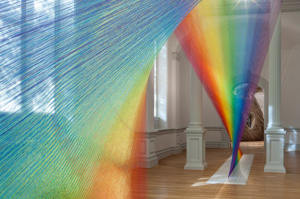 A rainbow of color created by weaving string together for WONDER at the Renwick Gallery.