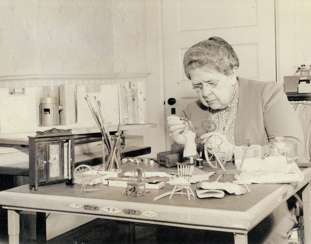 A photograph of Frances Glessner Lee at work on a Nutshell in the early 1940s.