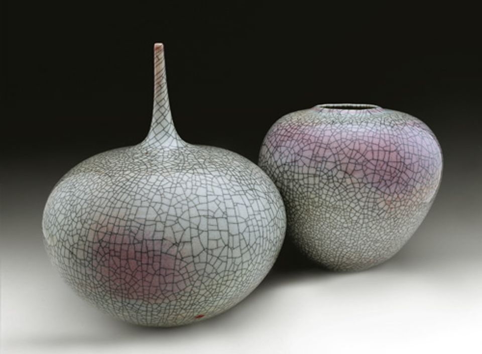 Two of Lee's vases made from porcelain with a purple and green glaze.