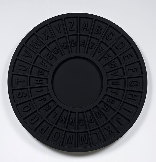A photograph of a black circular object.