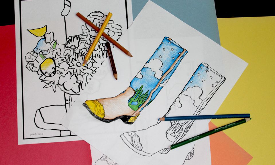A photograph of coloring pages with colored pencils 