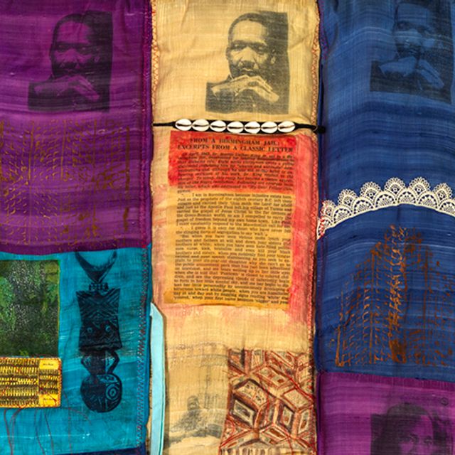 Detail of a quilt featuring images of Martin Luther King Jr.