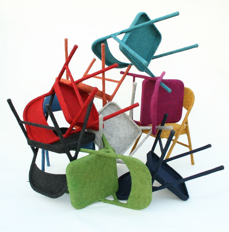 A picture of a stack of chairs made of felt.