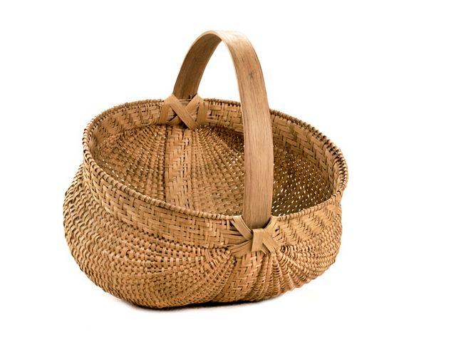 A basket that's short with a circular base and handle.