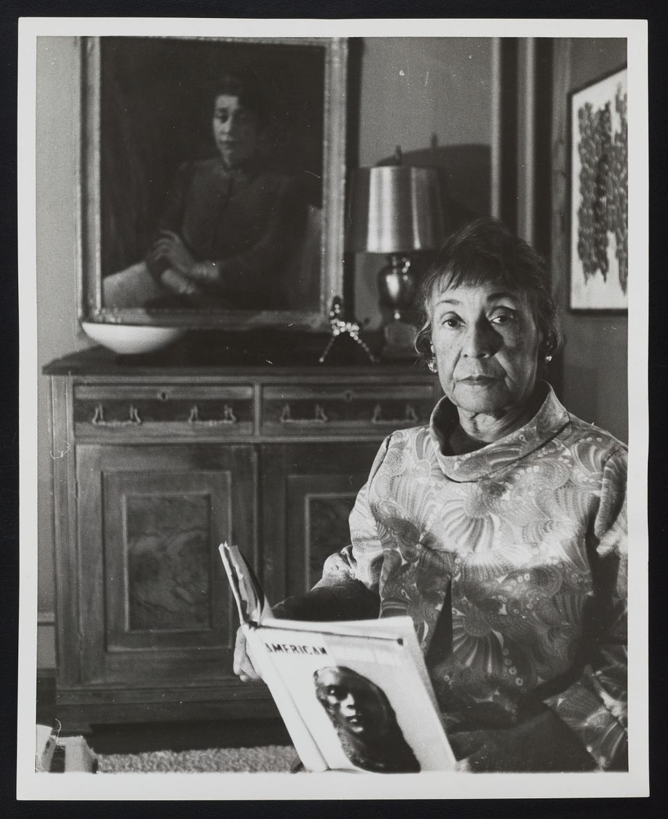 Alma Thomas with her portrait by Laura Wheeler Waring, Portrait of a Lady (1947, SAAM) in her home, Washington, DC, 1968. Photo by Ida Jervis. Alma Thomas papers, circa 1894-2001, Archives of American Art, Smithsonian Institution