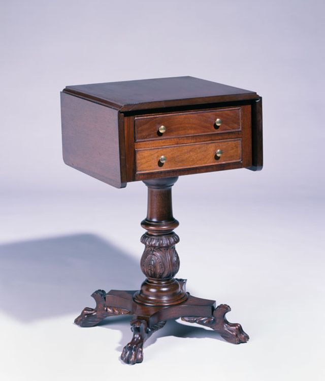 A mahogany, walnut, and cherry Classical style sewing stand. 