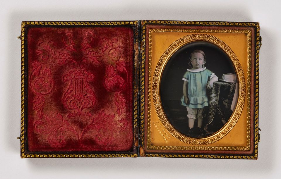 Image of a small child in a frame box