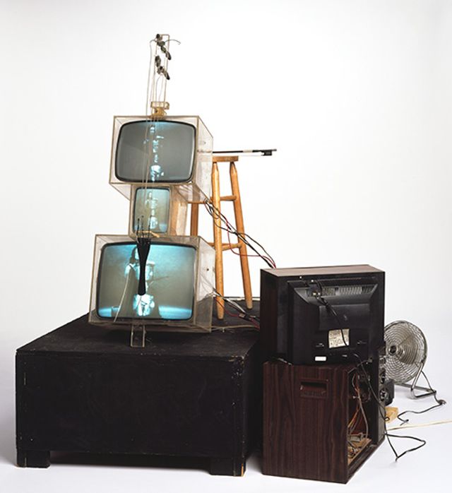Name June Paik's TV Cello made from plexiglas boxes, wiring, wood, fan.