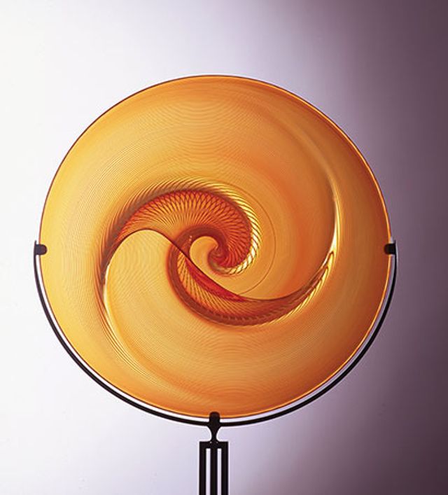 An orange glass circular object.