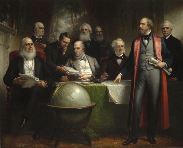 A room with men and a globe