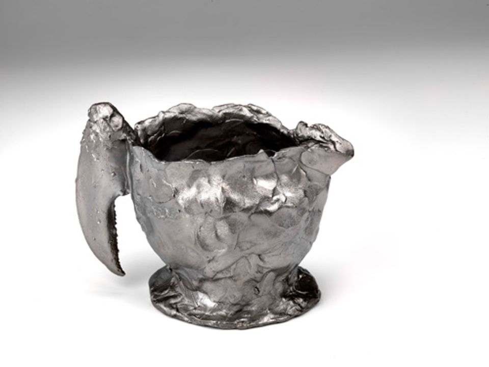 This is Jeffrey Clancy's Creamer with Lobster Claw and Concealed Decoration made from stainless steel for 40 Under 40 at the Renwick Gallery. 