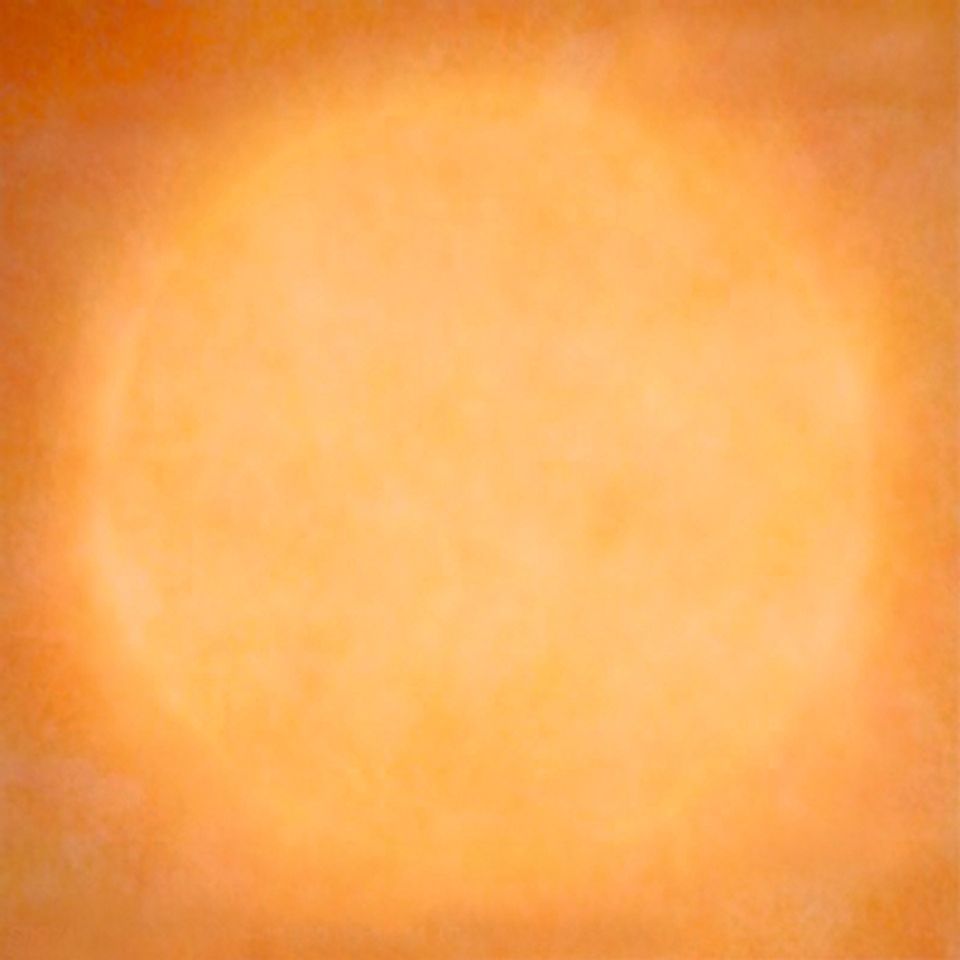 A photograph of the sun in an orange hue.