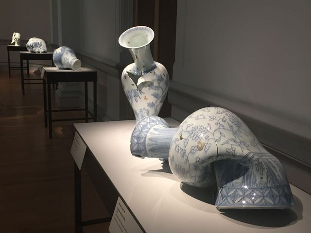 Gallery shot of five porcelain vases. 