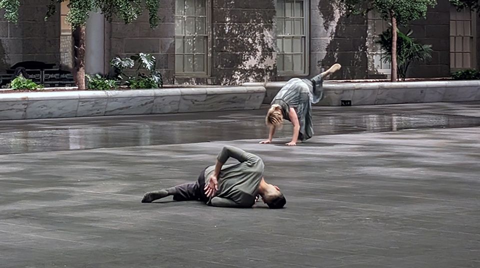 Two dancers perform in SAAM's Kogod Courtyard