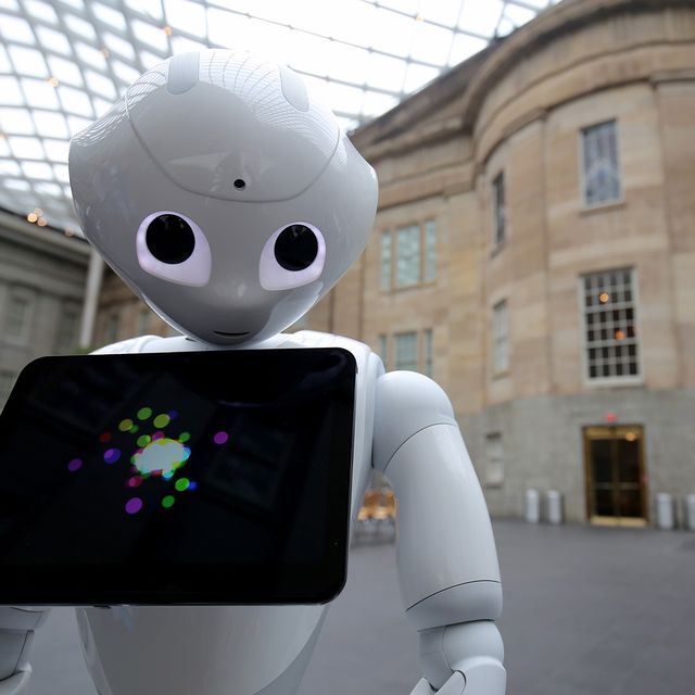 A photograph of Pepper the Smithsonian Robot inside the Kogod Courtyard at the Smithsonian American Art Museum.
