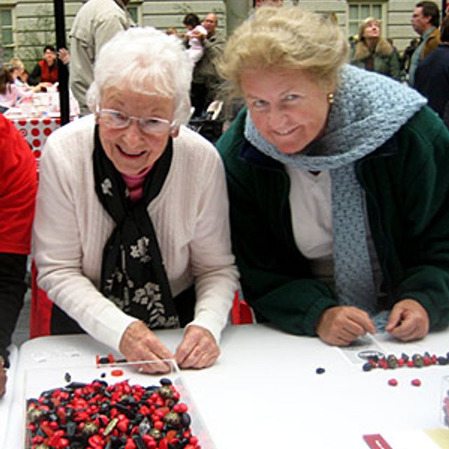 Shirley and Catherine at the Festival's Bead Making Station