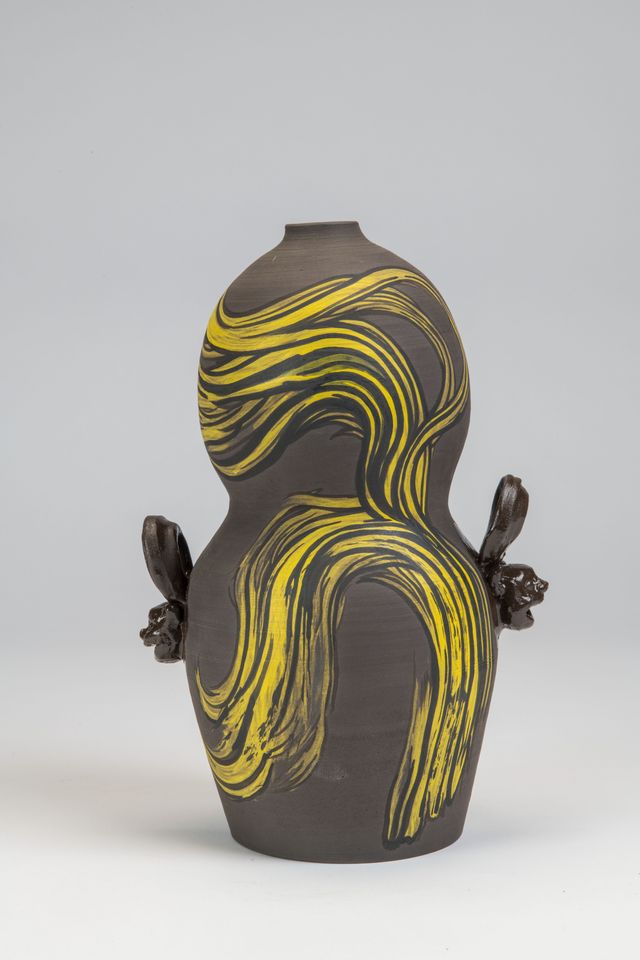 Object with yellow and black swirling designs