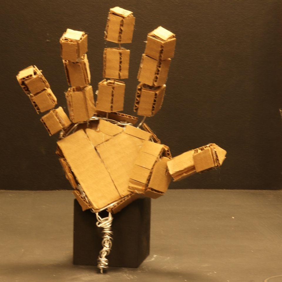 Card board sculpture of hand