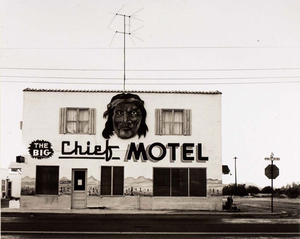 A photograph of the exterior or a motel in Arizona.