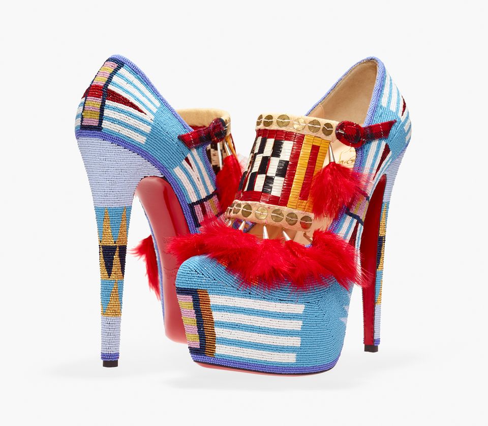 Two high heel shoes made fro beads, sequins, feathers and other items. 