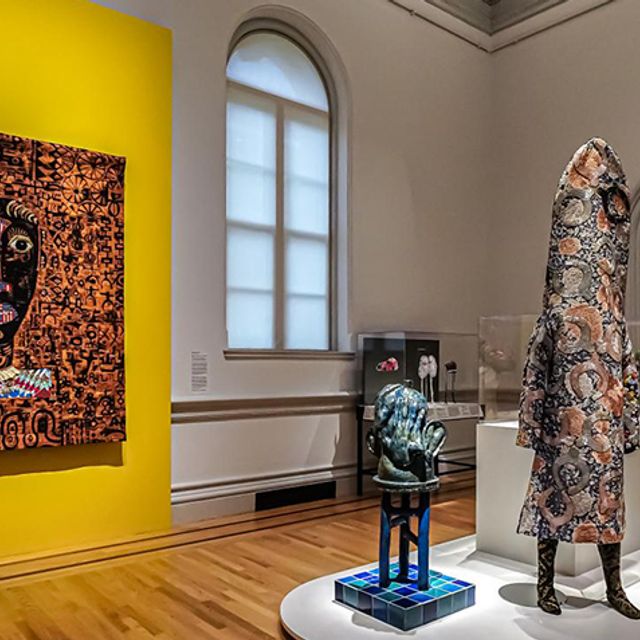 Gallery view of quilt and ceramic sculptures