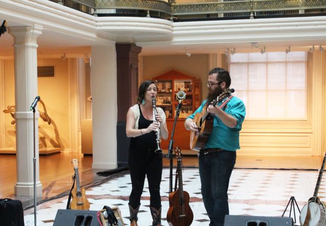 Two musicians play the oboe and the guitar in the Luce Foundation Center.