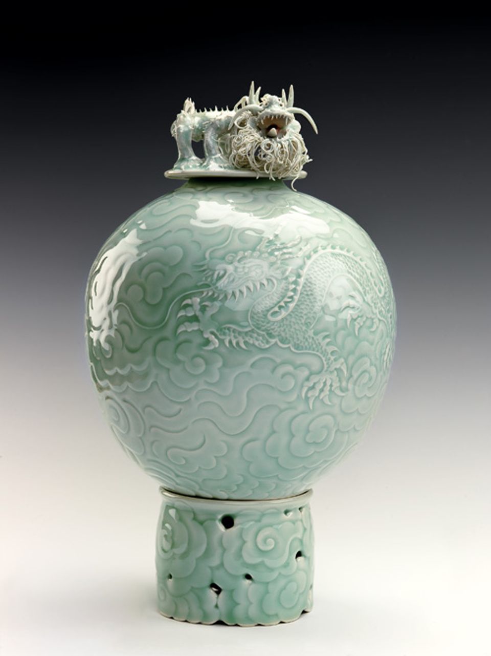 An image of Lee's porcelain object with a dragon embedded in the mold and placed on top.