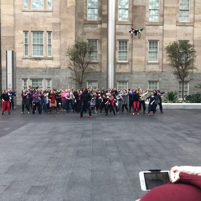 An image of staff members dancing in the Courtyard at SAAM.