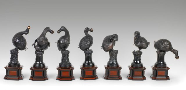 A photograph of seven sculpted dodo birds. 