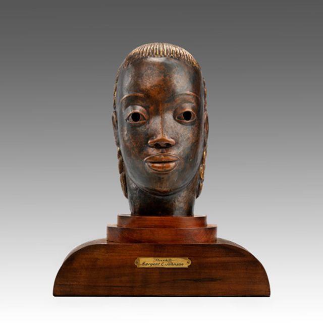 Johnson's copper and wood bust.