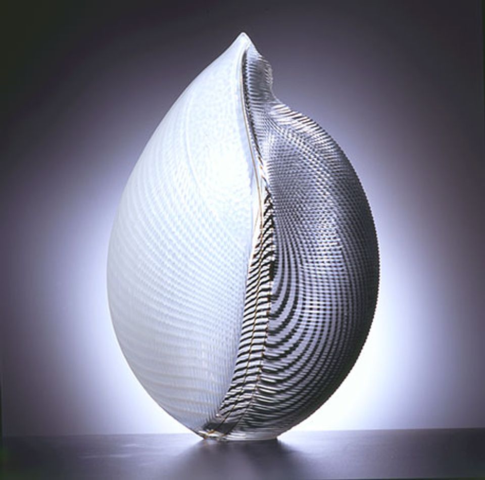 A white and black glass object. 