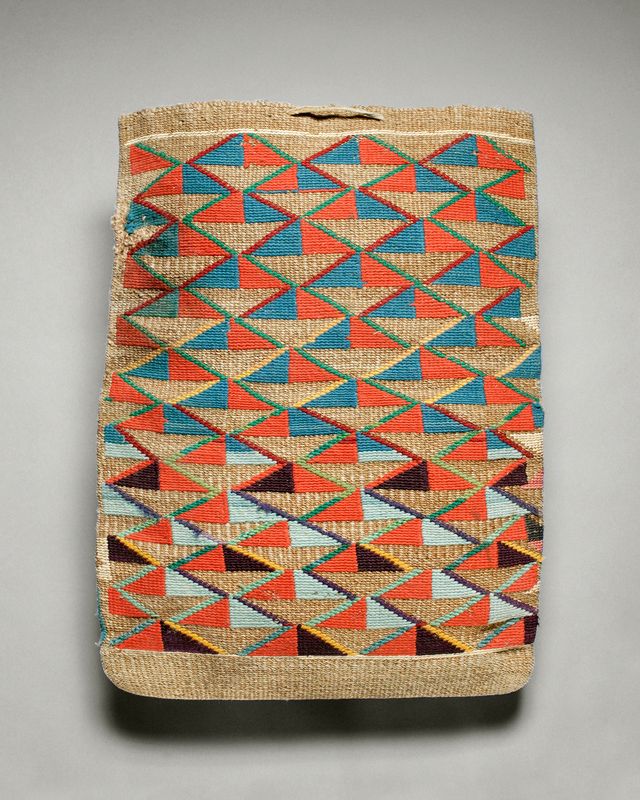 A woven bag with diagonal designs in orange, light blue, and turquoise.