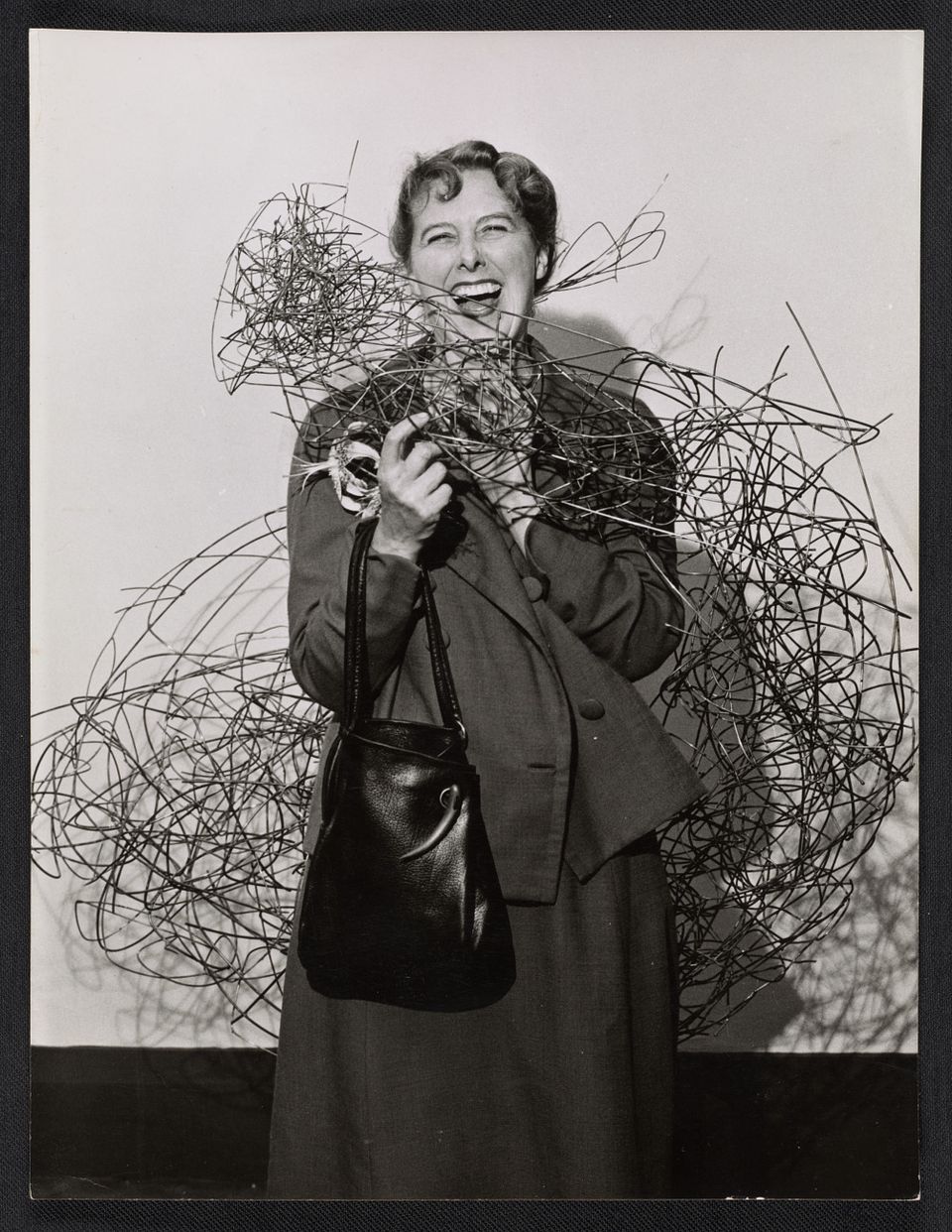 Claire Falkenstein with one of her sculptures, ca. 1946. Claire Falkenstein papers, circa 1914-1997, Archives of American Art, Smithsonian Institution