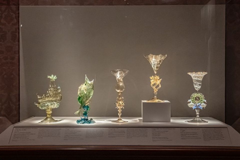 A row of glass goblets on display