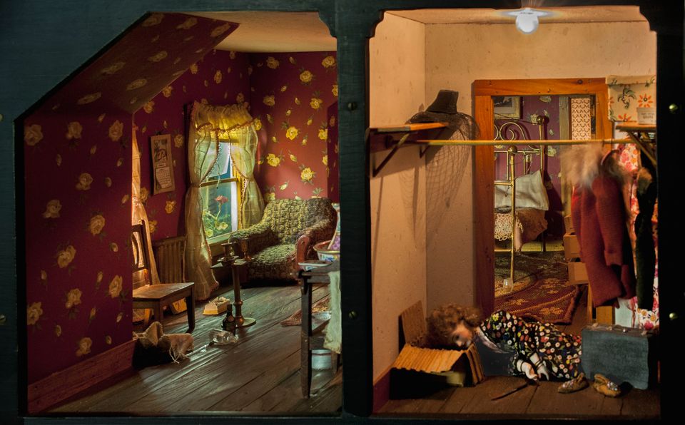 The image shows a view of two room of one of the doll houses
