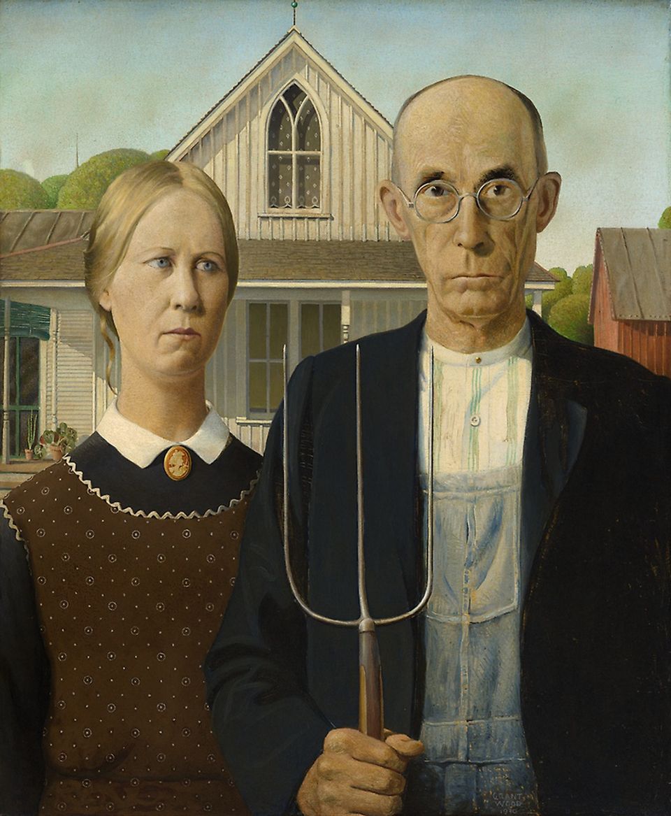 An image of a woman and a man with a house behind them. The man is holding a rake.