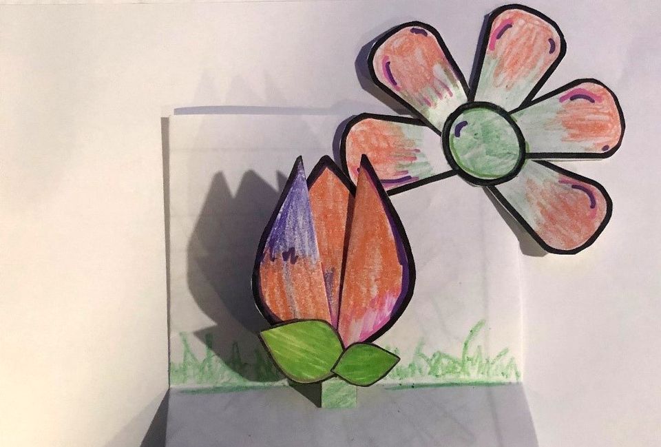 An arts and craft flower made of paper.