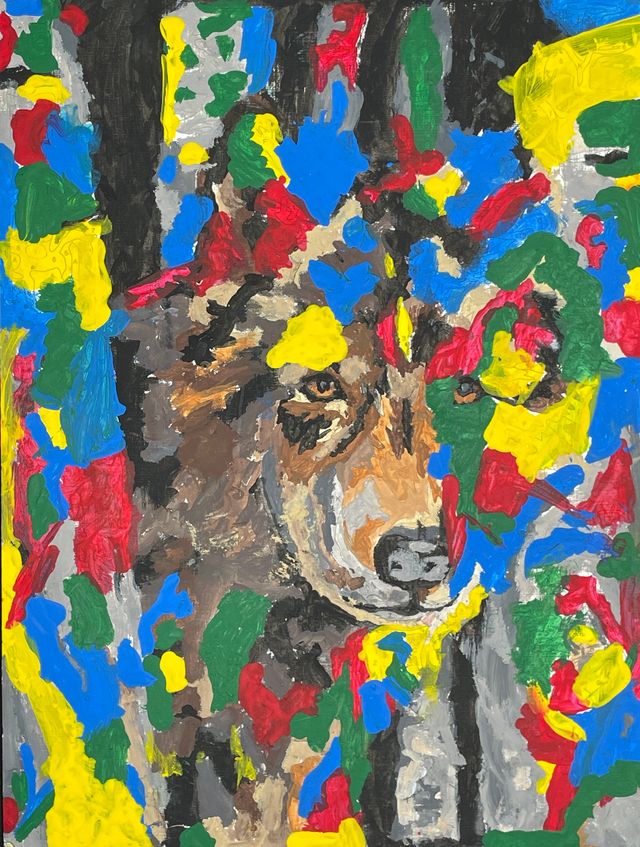 An abstract artwork with a dog's face in the center