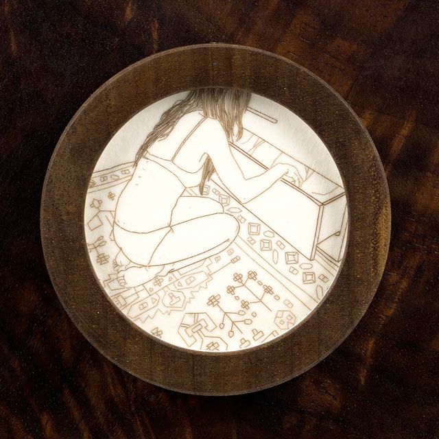 A circle with a drawing inside. 