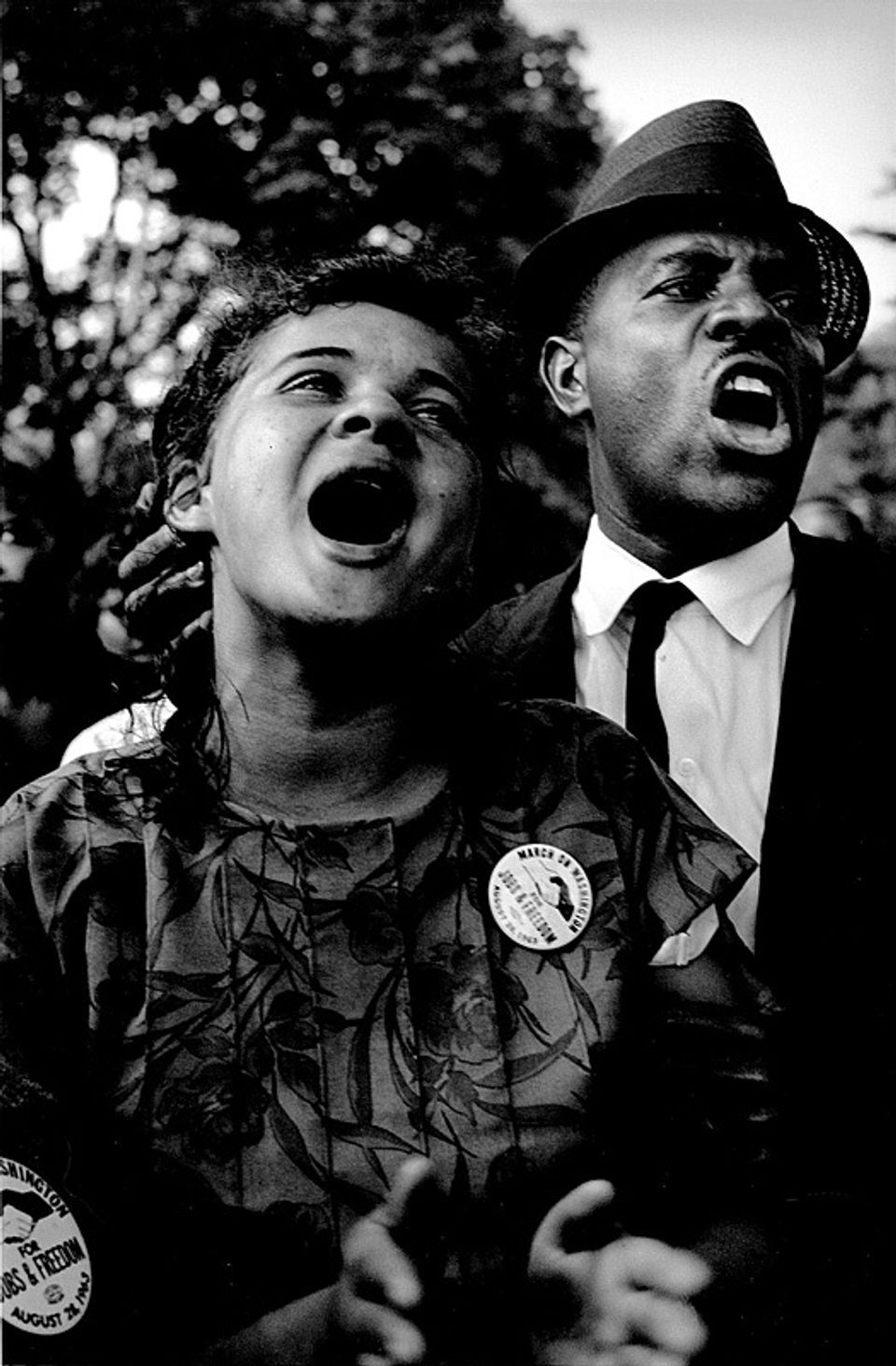 A photograph taken at the March on Washington of a woman and man yelling.