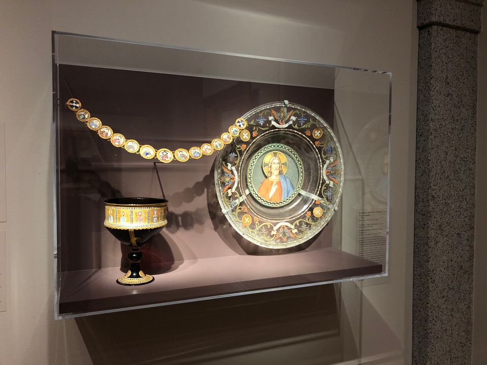 Mosaic plate in a glass case