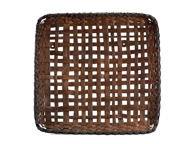 A basket that is square with a loose weave allowing for openings.