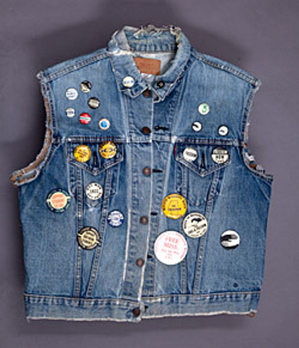 A jean jacket with pins