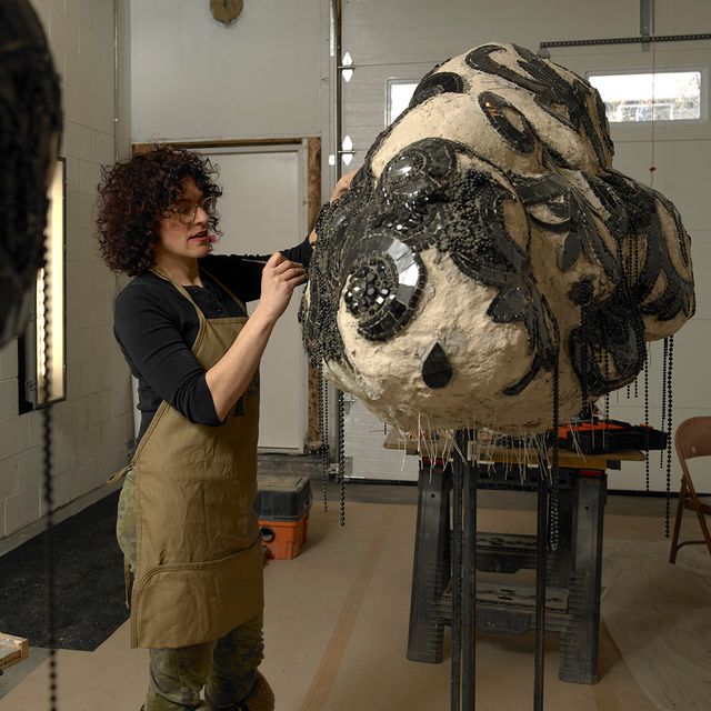 An image of an artist in their studio. 