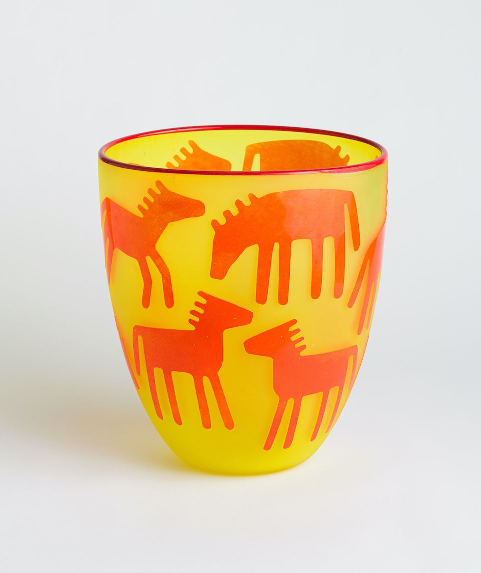 Yellow and Orange Glass Cup with Horses and Deer on it.