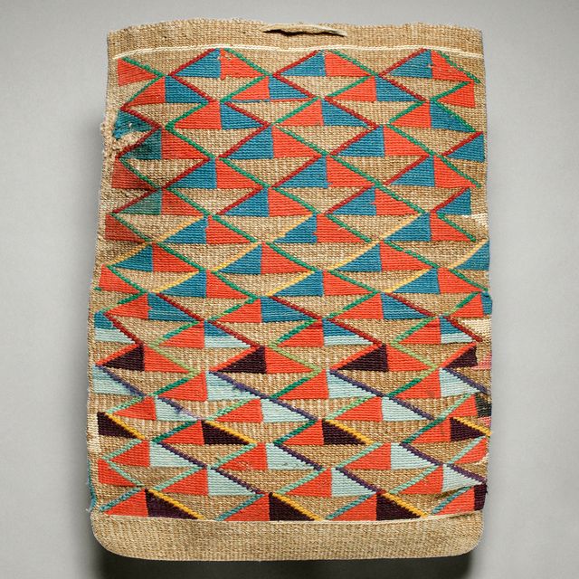 A woven bag with diagonal designs in orange, light blue, and turquoise.